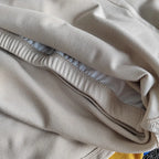 Close-up of beige fabric showcasing the texture of ladies fitness crop tops from The Lady's Haven Boutique