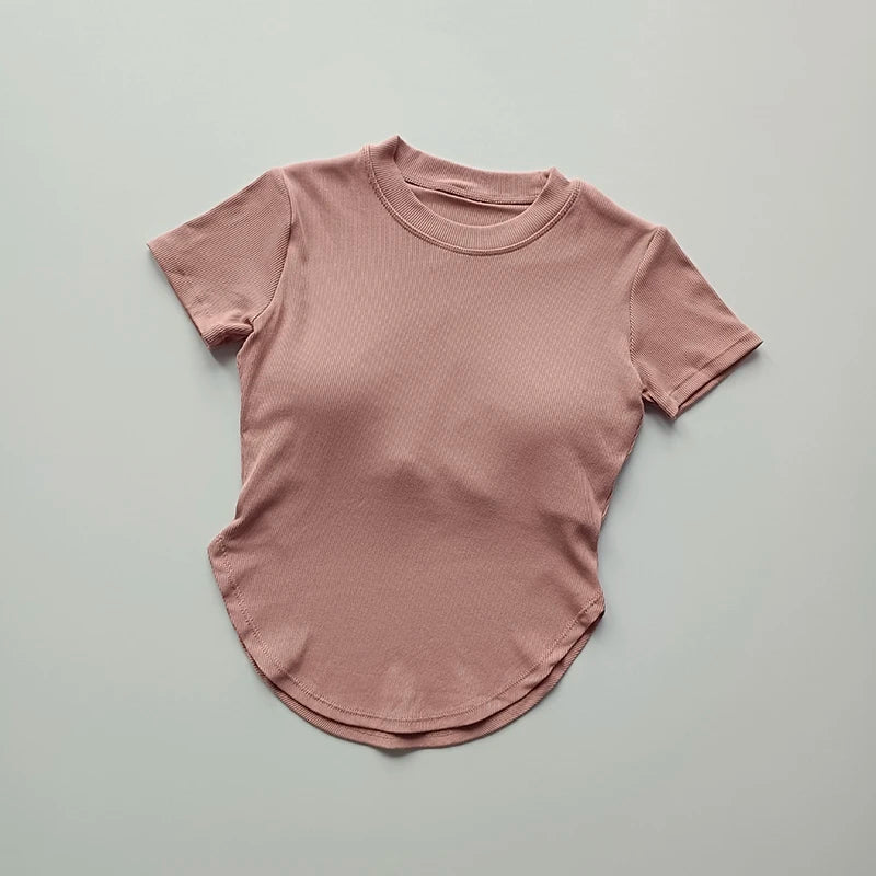Light pink ladies fitness crop top with a comfortable fit for workouts and casual wear
