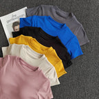 Variety of ladies fitness crop tops in pastel and bold colors for activewear styling