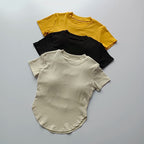 Three ladies fitness crop tops in yellow, black, and cream for stylish and comfortable workouts