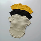 Ladies fitness crop tops in yellow, black, and cream for activewear enthusiasts