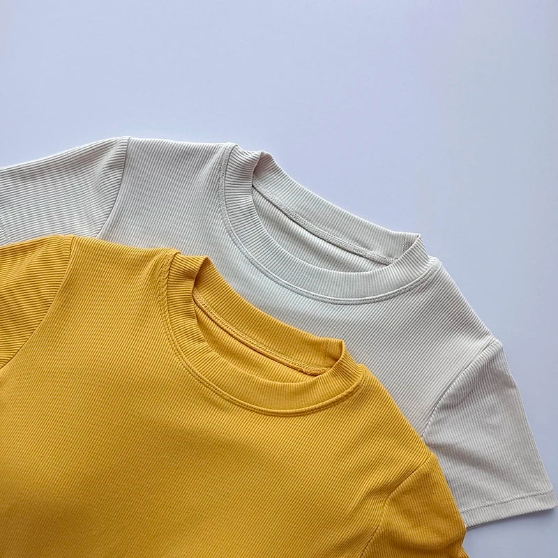 Set of ladies fitness crop tops in yellow and gray for stylish activewear options