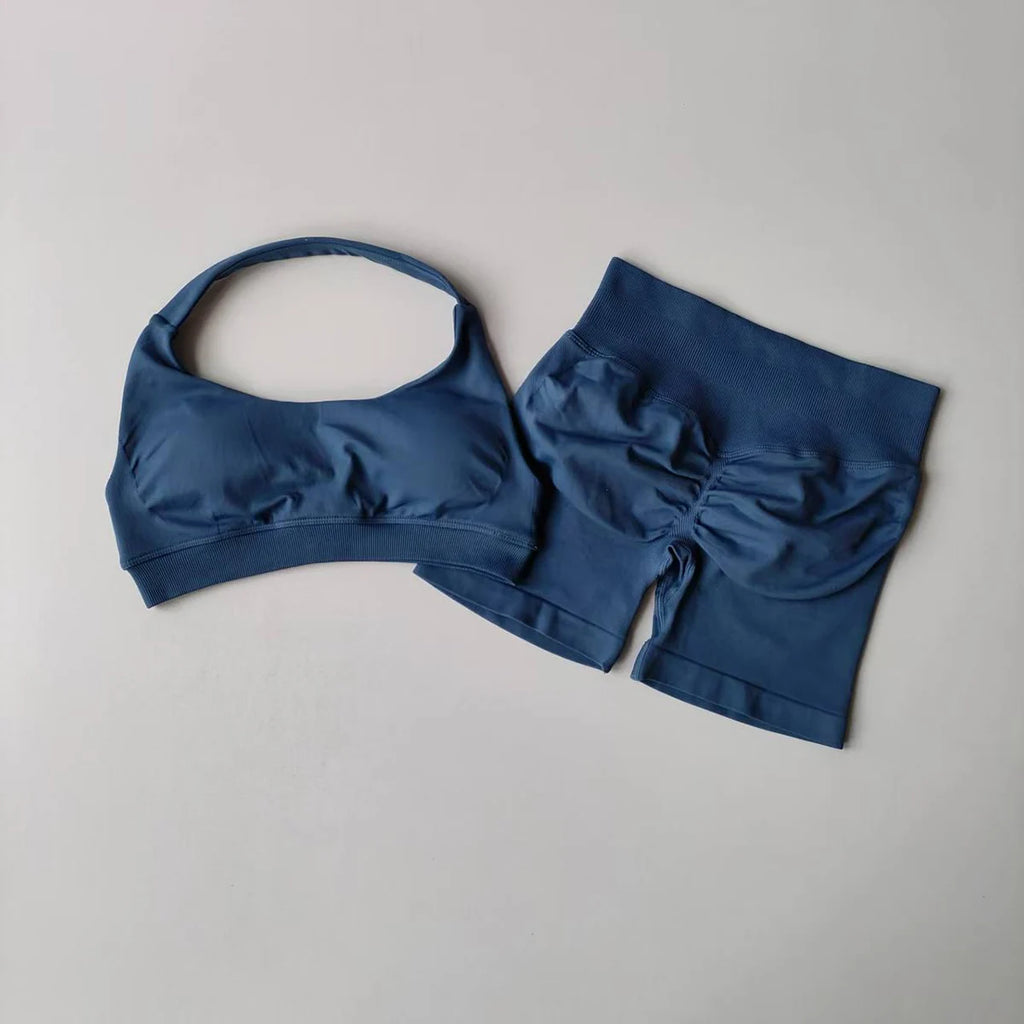 Stylish ladies fitness outfit matching set in navy blue with a crop top and shorts for activewear