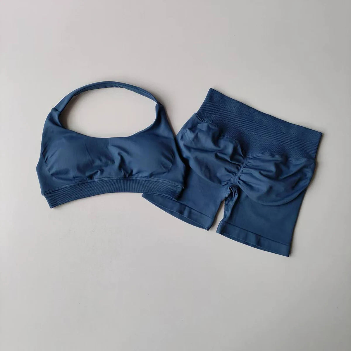 Stylish ladies fitness outfit matching set in navy blue with a crop top and shorts for activewear