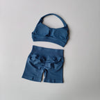Ladies fitness outfit matching set in blue featuring a sporty bra and shorts for workout comfort