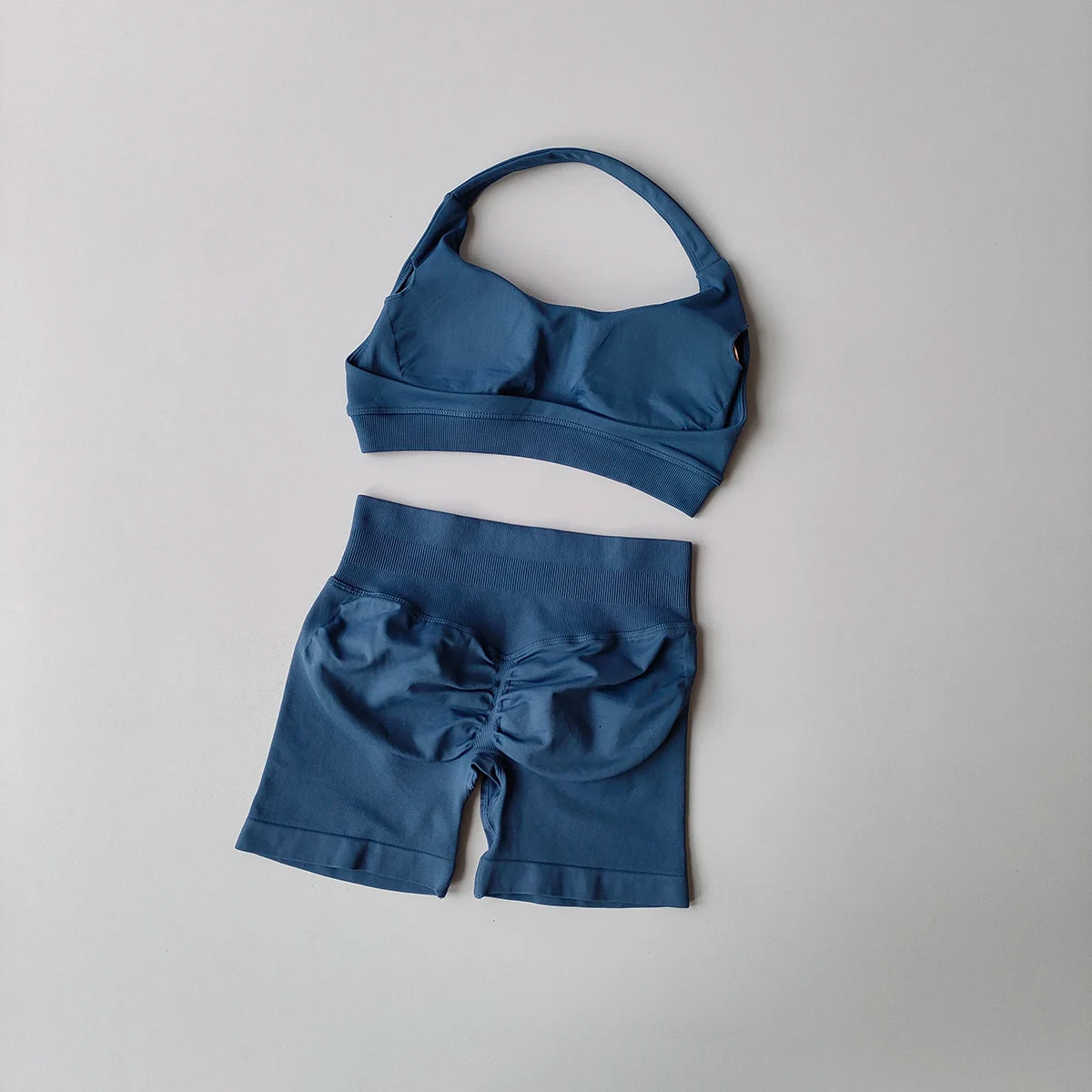 Ladies fitness outfit matching set in blue featuring a sporty bra and shorts for workout comfort