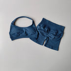 Ladies fitness outfit matching set in blue featuring a stylish sports bra and high-waisted shorts