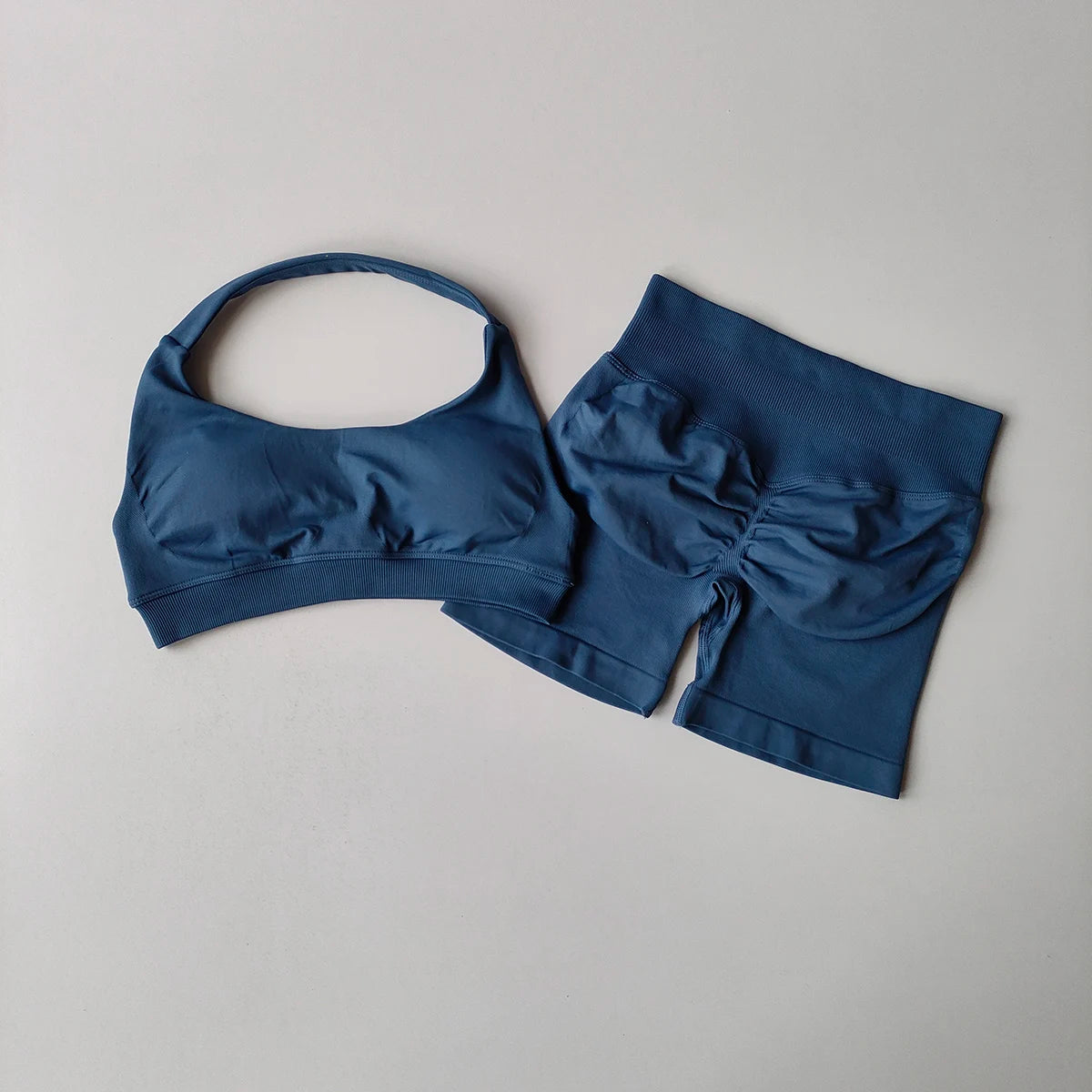 Ladies fitness outfit matching set in blue featuring a crop top and high-waisted shorts