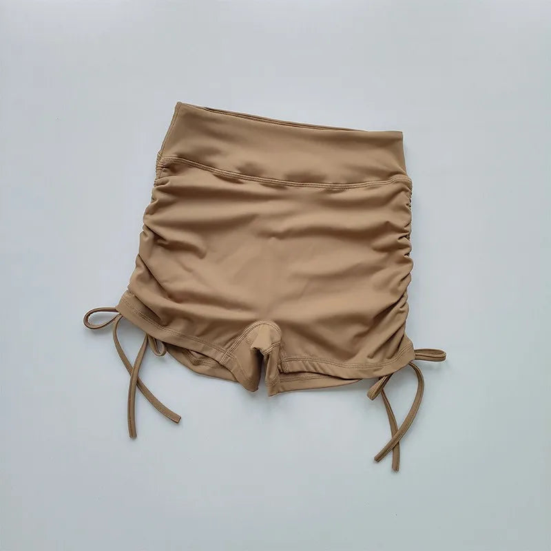 Ladies high waist workout shorts in beige with adjustable side ties for comfort and style