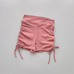 Ladies high waist workout shorts in soft pink with adjustable side ties for comfort and style