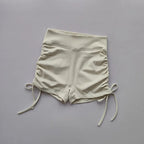 Ladies high waist workout shorts in cream color with adjustable drawstrings for a comfortable fit