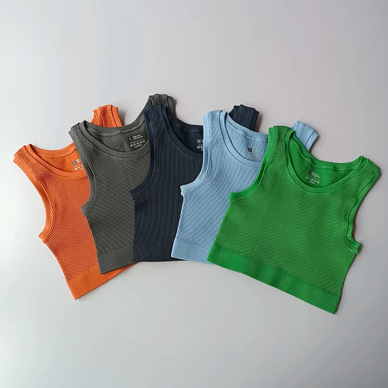 Colorful ladies seamless yoga vest collection in orange, gray, navy, blue, and green for active wear