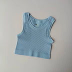 Ladies seamless yoga vest in soft blue color with a ribbed texture for comfortable workouts