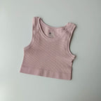 Ladies seamless yoga vest in soft pink ribbed fabric for comfortable workouts and casual wear