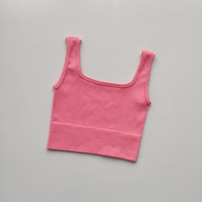 Ladies seamless yoga vest in pink with a comfortable ribbed design for active wear and workouts