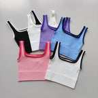 Set of six ladies seamless yoga vests in various colors including black, white, pink, and blue