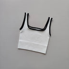 Ladies seamless yoga vest in white with black trim, perfect for workouts and casual wear