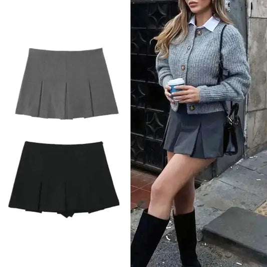 Spring summer casual skorts in gray and black with pleats shown on model wearing gray skort with boots