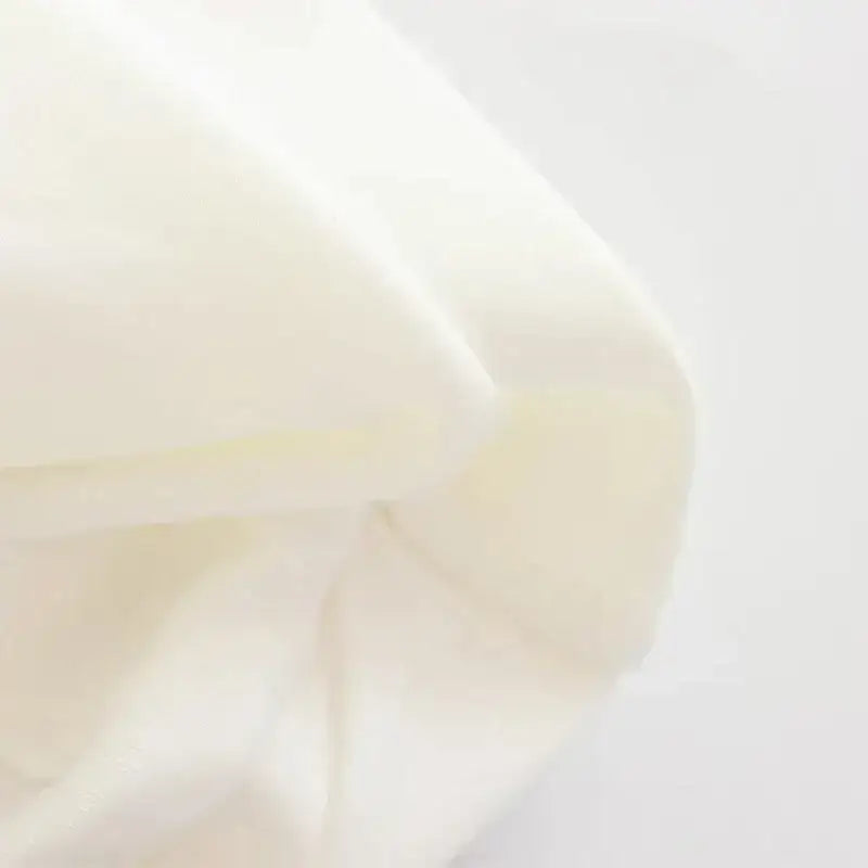 Close-up of soft white fabric material for a strapless corset top from The Lady's Haven Boutique