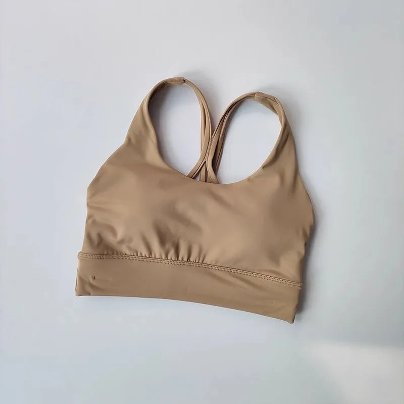 Beige ladies two piece gym suit top with a stylish racerback design for active women