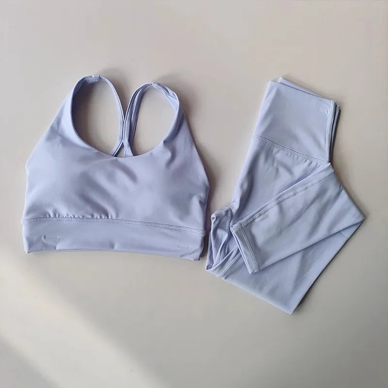 Ladies two piece gym suit in light purple with sleek design for stylish workouts
