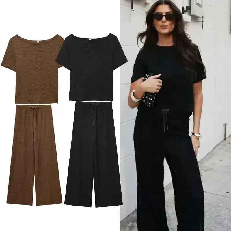 Two piece wide leg pant set in black and brown with short sleeve tops and drawstring waist pants