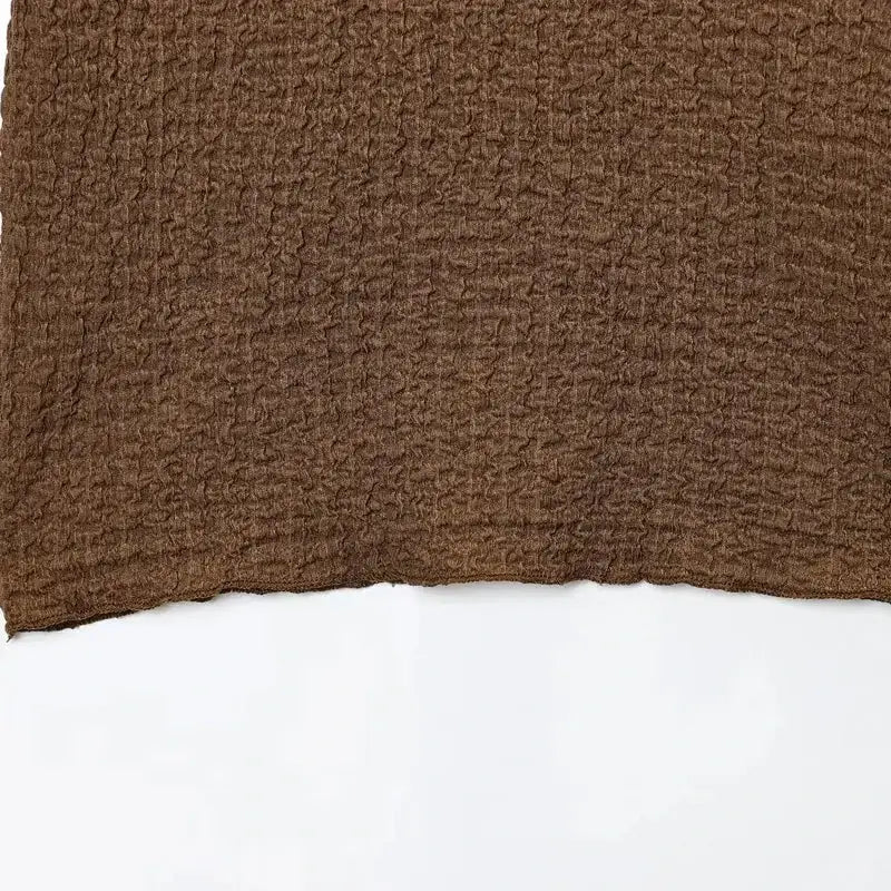 Brown textured fabric close-up from The Lady's Haven Boutique two piece wide leg pant set