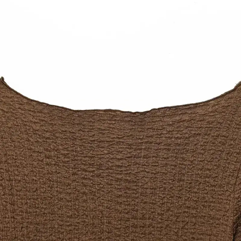 Close-up of brown textured fabric detail from The Lady's Haven Boutique two piece wide leg pant set