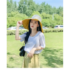 Stylish wide-brimmed yellow hat from The Lady's Haven Boutique featuring UPF 50 sun protection