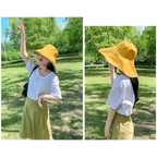 Yellow UPF 50 sun protection hat worn outdoors, perfect for sunny days and stylish outfits