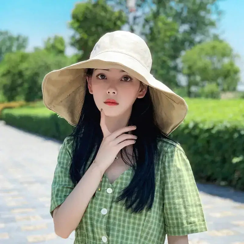 Light beige UPF 50 sun protection hat worn outdoors, ideal for sunny days and casual outings