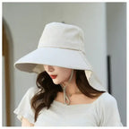Ladies UV sun protection bucket hat in beige with wide brim for outdoor enjoyment