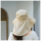 Back view of a ladies UV sun protection bucket hat in beige, ideal for outdoor activities