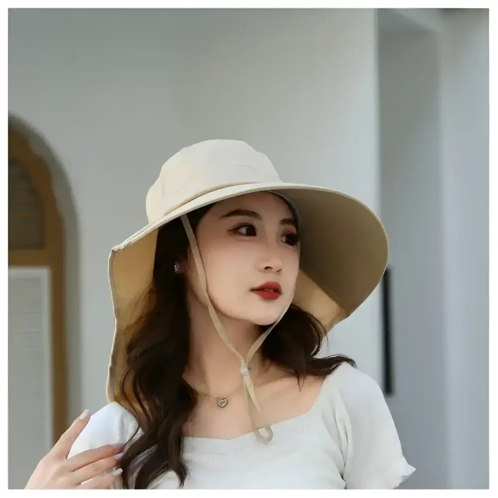 Ladies UV sun protection bucket hat in beige with wide brim for sun safety and style