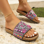 Flat heel ladies vacation beach slippers with colorful beaded design and cork sole from The Lady's Haven Boutique