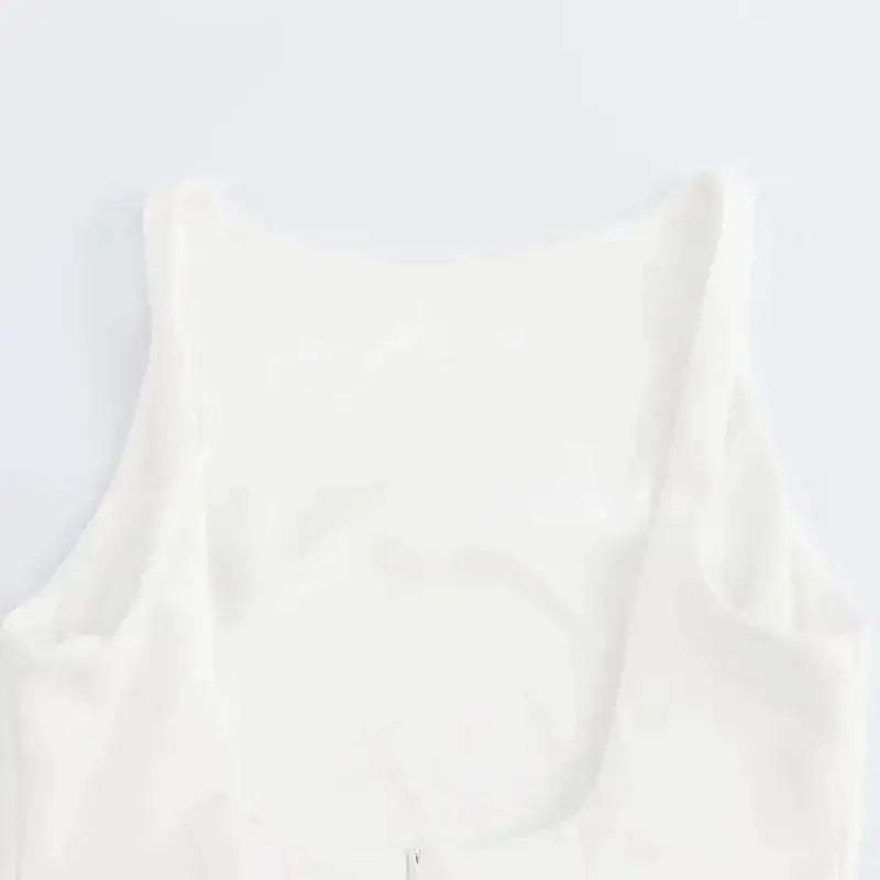 Close-up of the neckline on a white summer party mini dress from The Lady's Haven Boutique