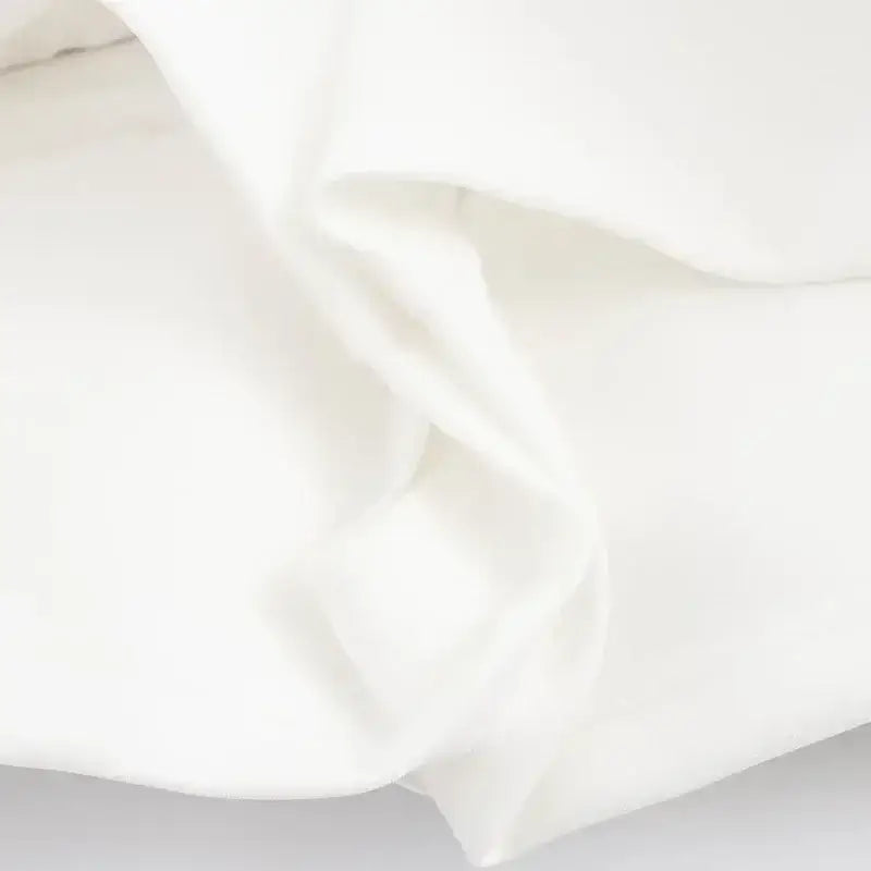 Soft white fabric texture for white summer party mini dress by The Lady's Haven Boutique