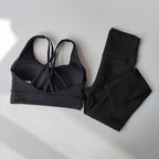 Black ladies workout clothes set featuring a stylish sports bra and high-waisted leggings