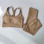 Stylish ladies workout clothes set in beige featuring a stylish sports bra and matching leggings