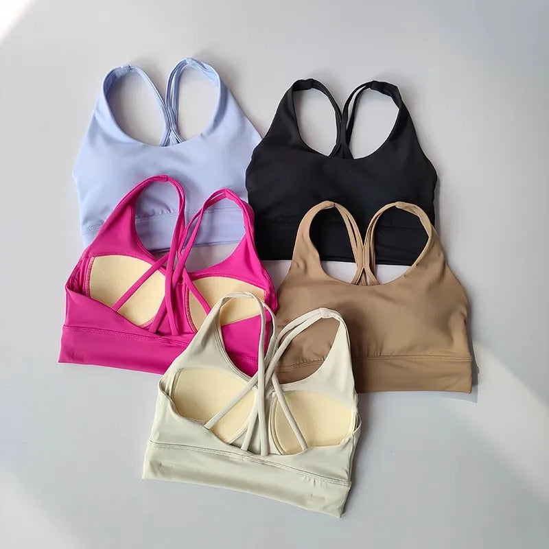 Five stylish ladies workout clothes set including various colors and strappy designs