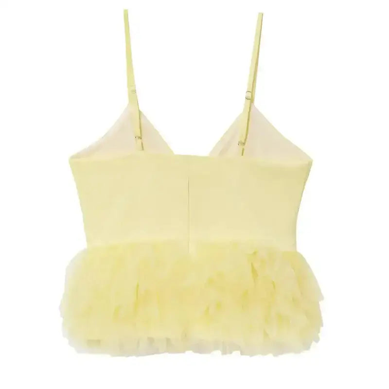 Yellow puffy sleeveless summer top with ruffled hem and adjustable straps from The Lady's Haven Boutique