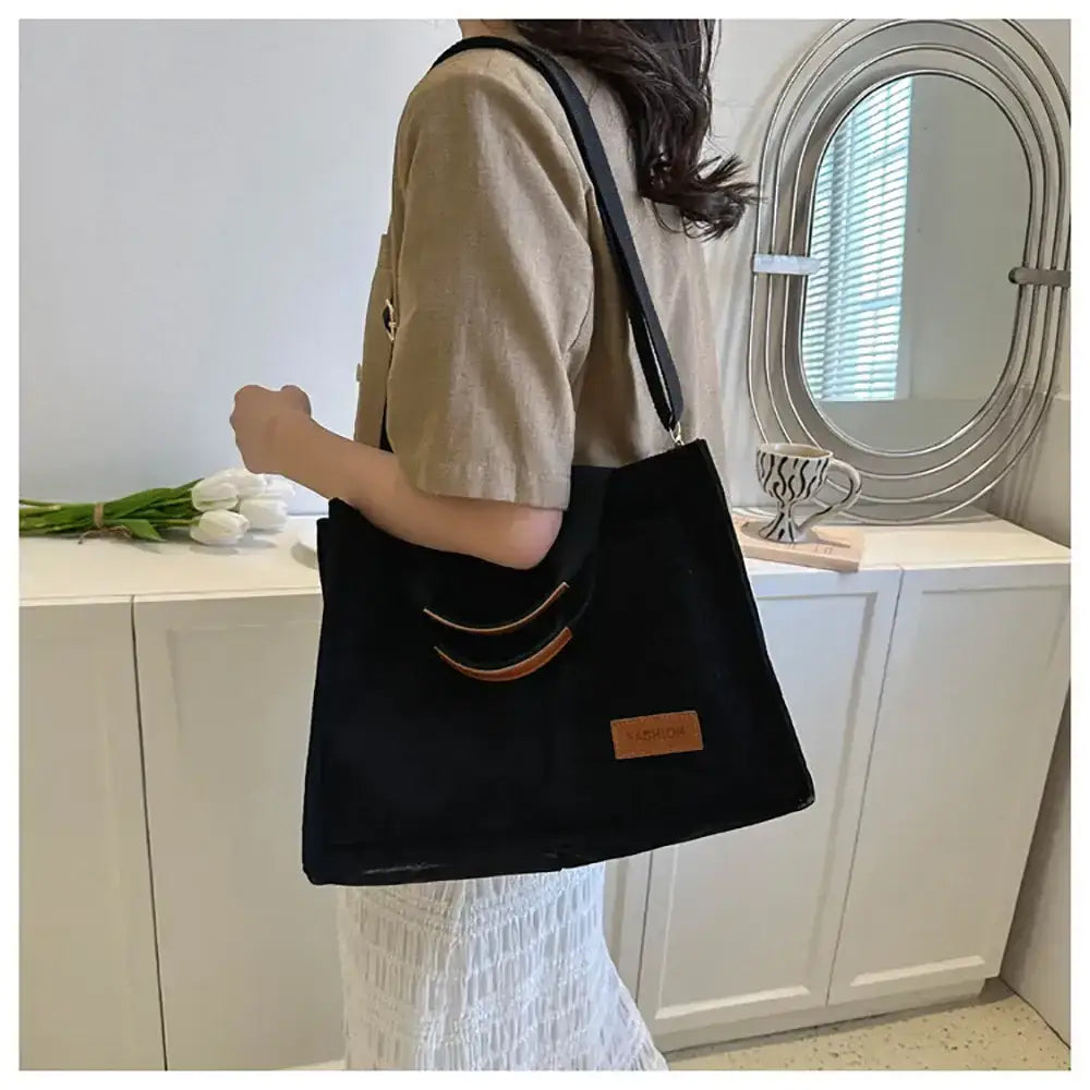 Stylish black large capacity handbag ideal for daily use and versatile styling