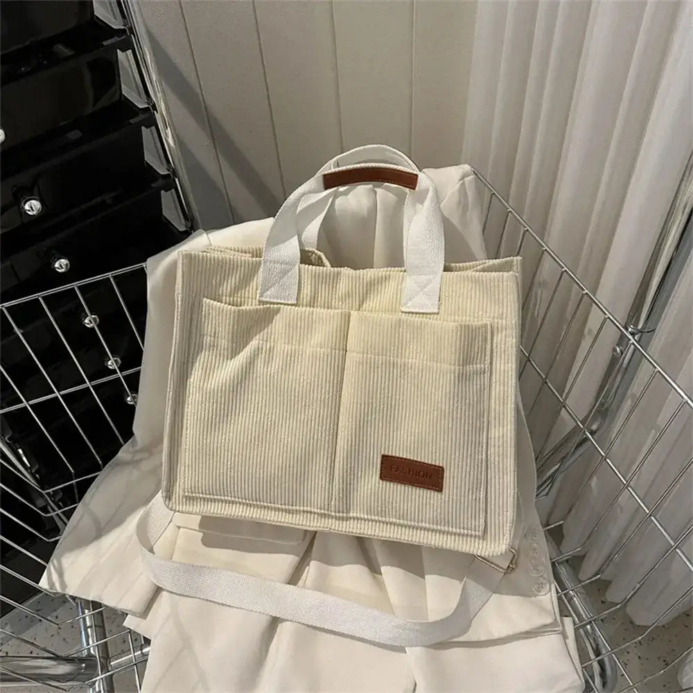Large capacity handbag by The Lady's Haven in cream color with multiple pockets for everyday essentials