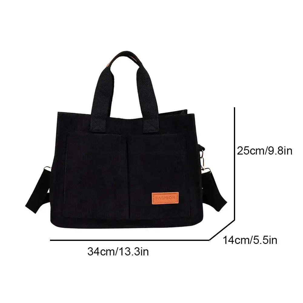Stylish black large capacity handbag with adjustable shoulder strap and versatile design