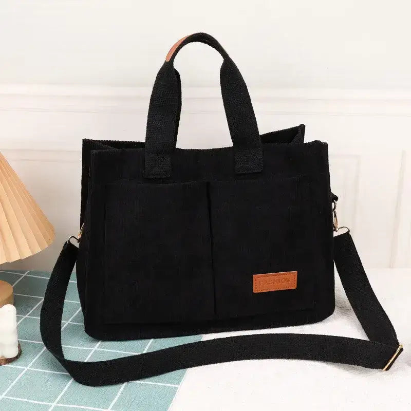 The Lady's Haven large capacity handbag in black with dual handles and adjustable strap for versatile use
