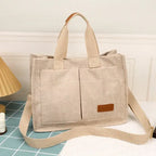 Beige large capacity handbag with multiple pockets for organized storage and a stylish design