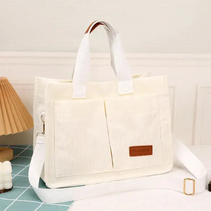 Stylish cream handbag with large capacity handbag design and multiple pockets for organized storage