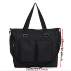 Stylish black large capacity shopper handbag with front pockets and adjustable straps for everyday use