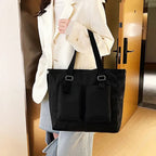 Stylish black large capacity shopper handbag with two front pockets for everyday use