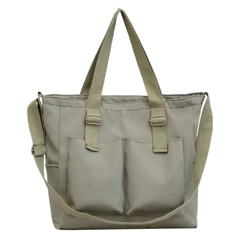 Large capacity shopper handbag in beige with exterior pockets and adjustable straps